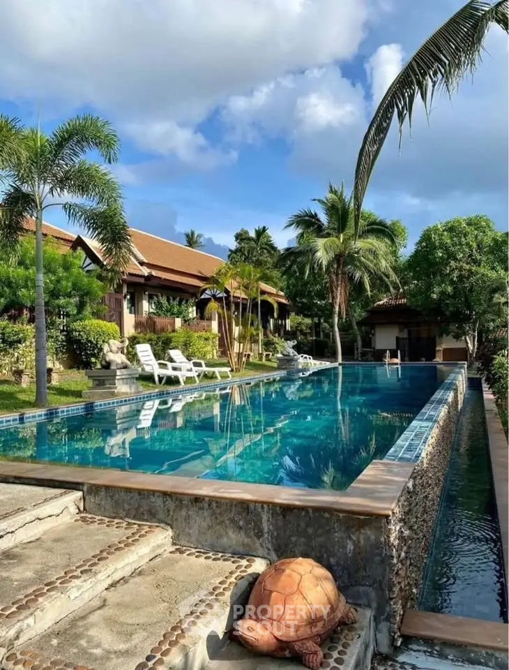 Luxurious tropical villa with stunning pool and lush garden