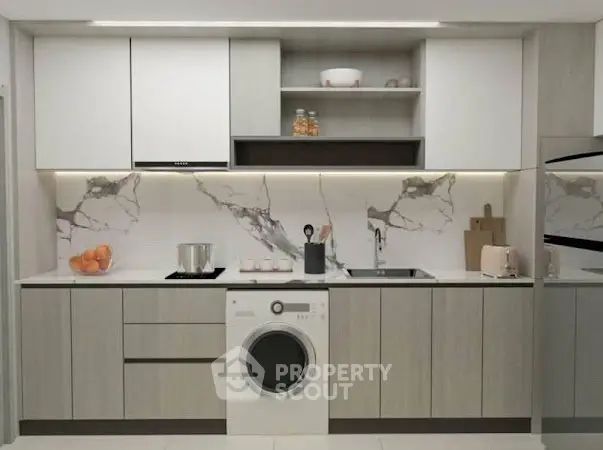 Modern kitchen with sleek cabinetry, marble backsplash, and built-in washing machine.