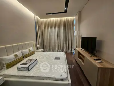 Luxurious modern bedroom with elegant lighting and sleek furnishings