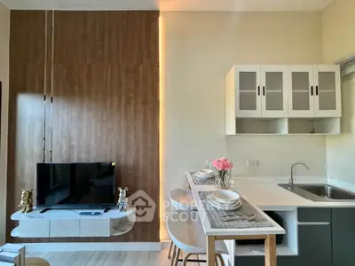 Modern kitchen with sleek cabinetry and breakfast bar in stylish apartment