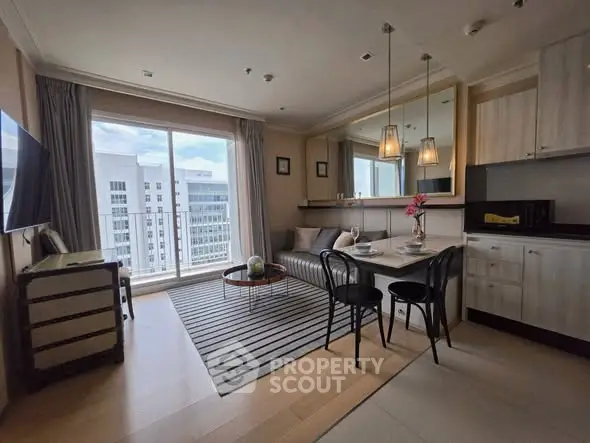Modern living room with open kitchen and city view, featuring stylish decor and ample natural light.