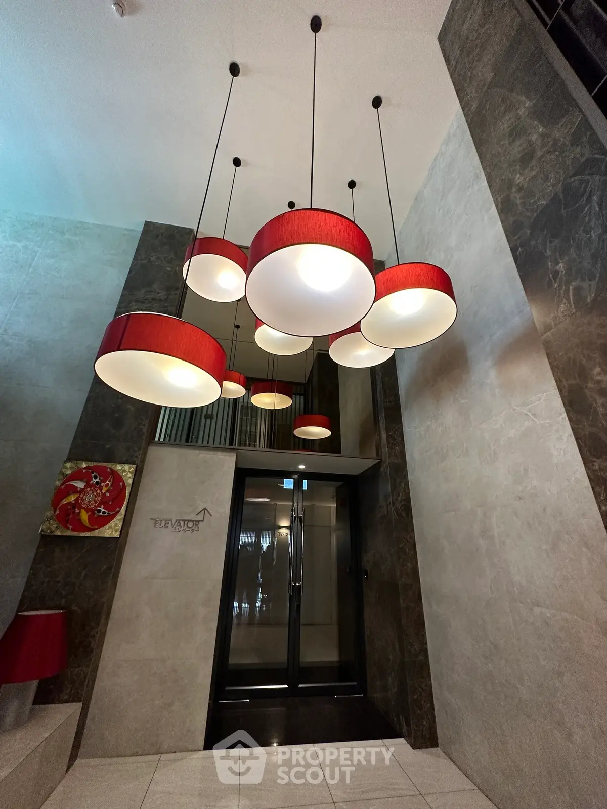 Elegant building entrance with modern lighting and elevator access