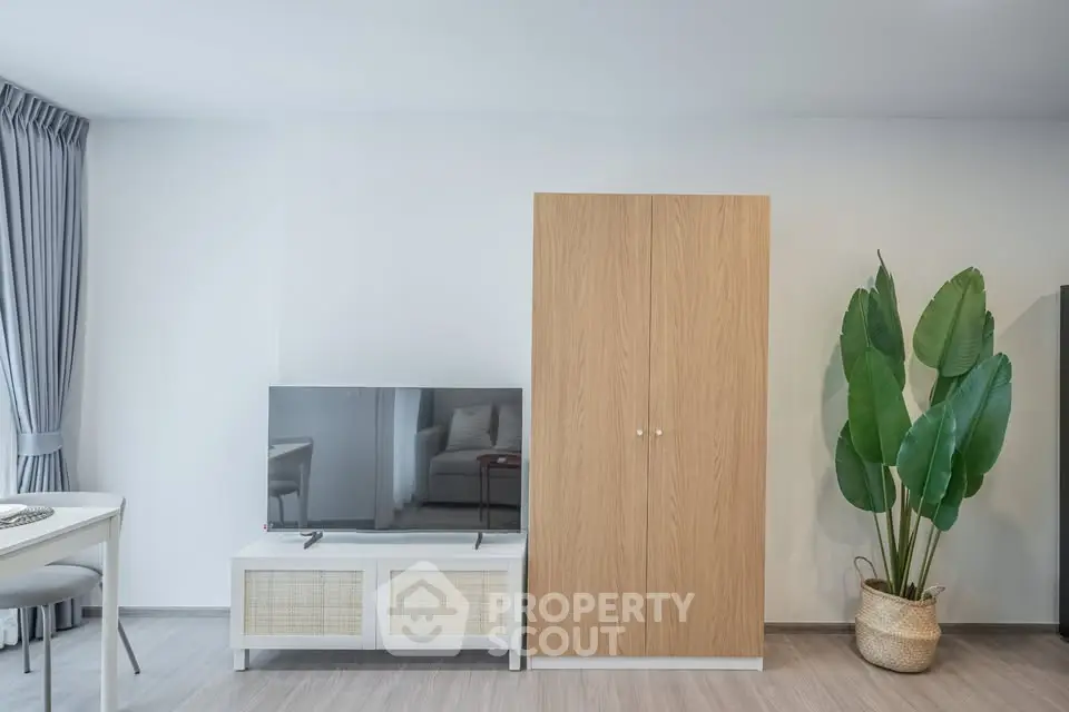 Modern living room with sleek TV stand and stylish wardrobe