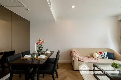 Modern living room with elegant dining area and cozy sofa, perfect for stylish urban living.