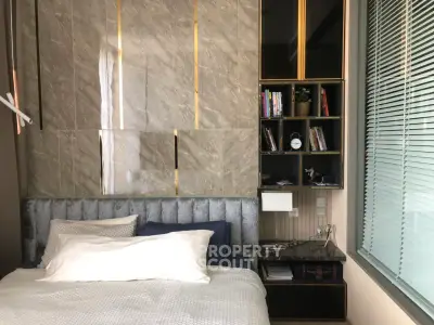 Luxurious bedroom with modern design and elegant decor, featuring a plush bed and stylish shelving.