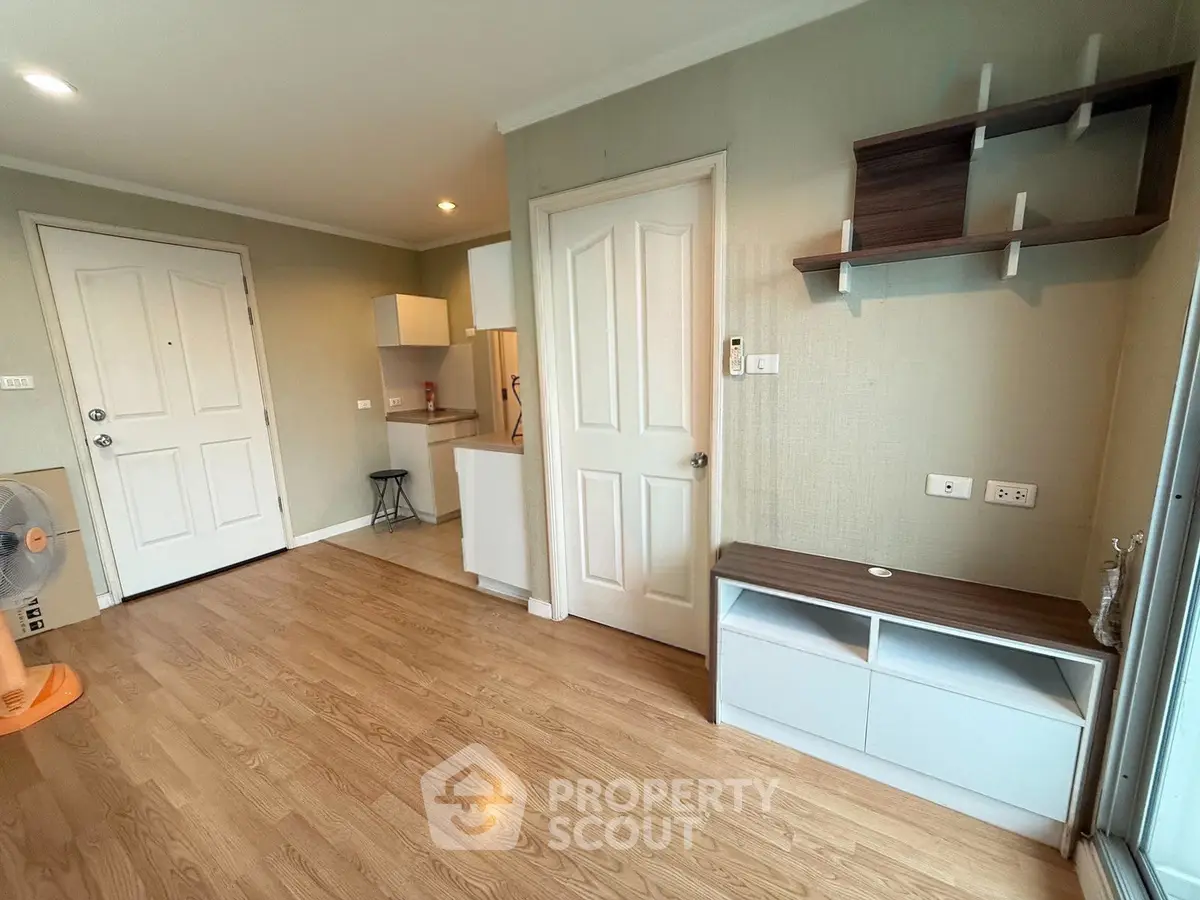 Modern apartment interior with wooden flooring and stylish shelving