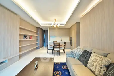 Modern open-plan living room with elegant kitchen and stylish decor