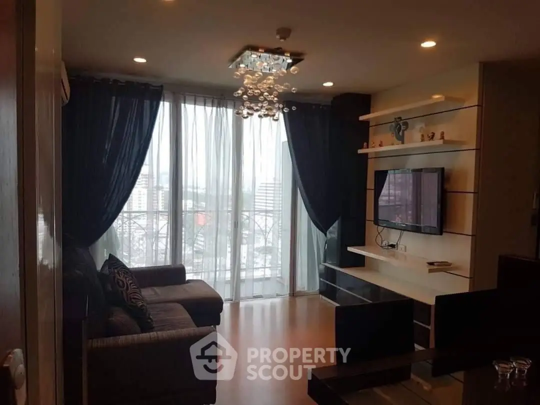 Modern living room with large window and stylish decor