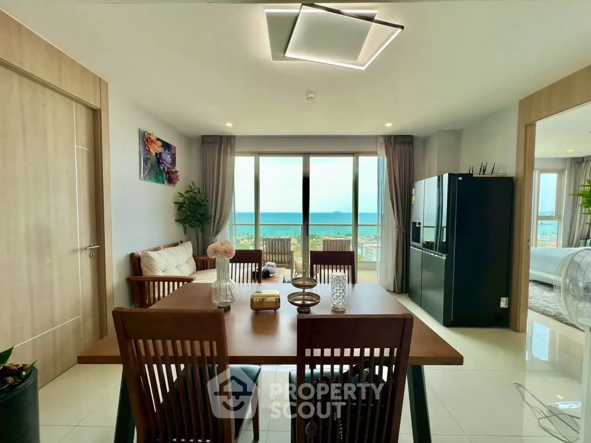 Stunning beachfront dining area with modern decor and expansive ocean views.