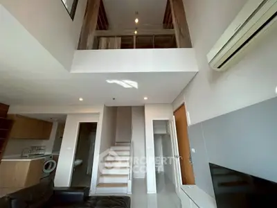 Modern duplex apartment with open layout and stylish interior design