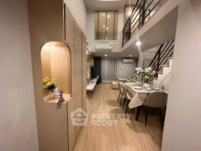 Modern duplex living room with elegant dining area and stylish decor