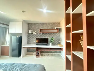 Modern living room with stylish shelving and sleek TV setup, perfect for contemporary urban living.