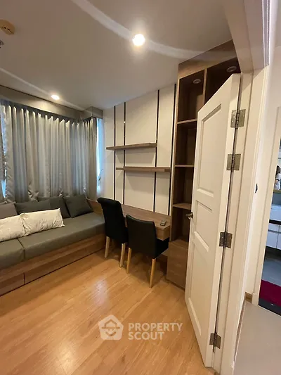 Modern living room with cozy seating and stylish shelving