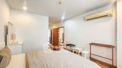 Spacious bedroom with modern air conditioning and minimalist decor