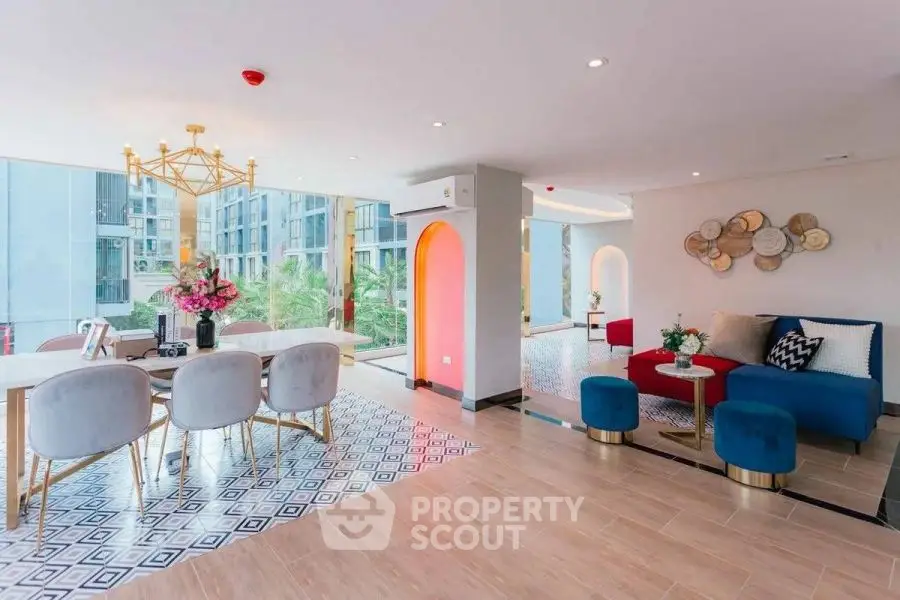 Luxurious open-plan living and dining area with modern decor and large windows.