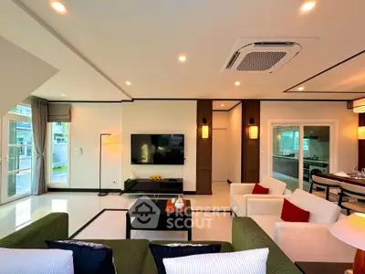 Luxurious living room with modern decor and large windows in a high-end apartment.