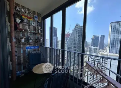 Chic urban balcony with stunning city skyline view, perfect for relaxation and enjoying the vibrant city life.