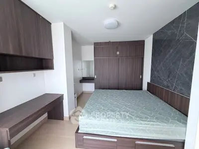 Modern bedroom with stylish wooden furniture and built-in storage