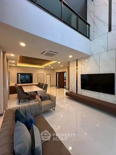 Luxurious modern living room with high ceilings and elegant decor