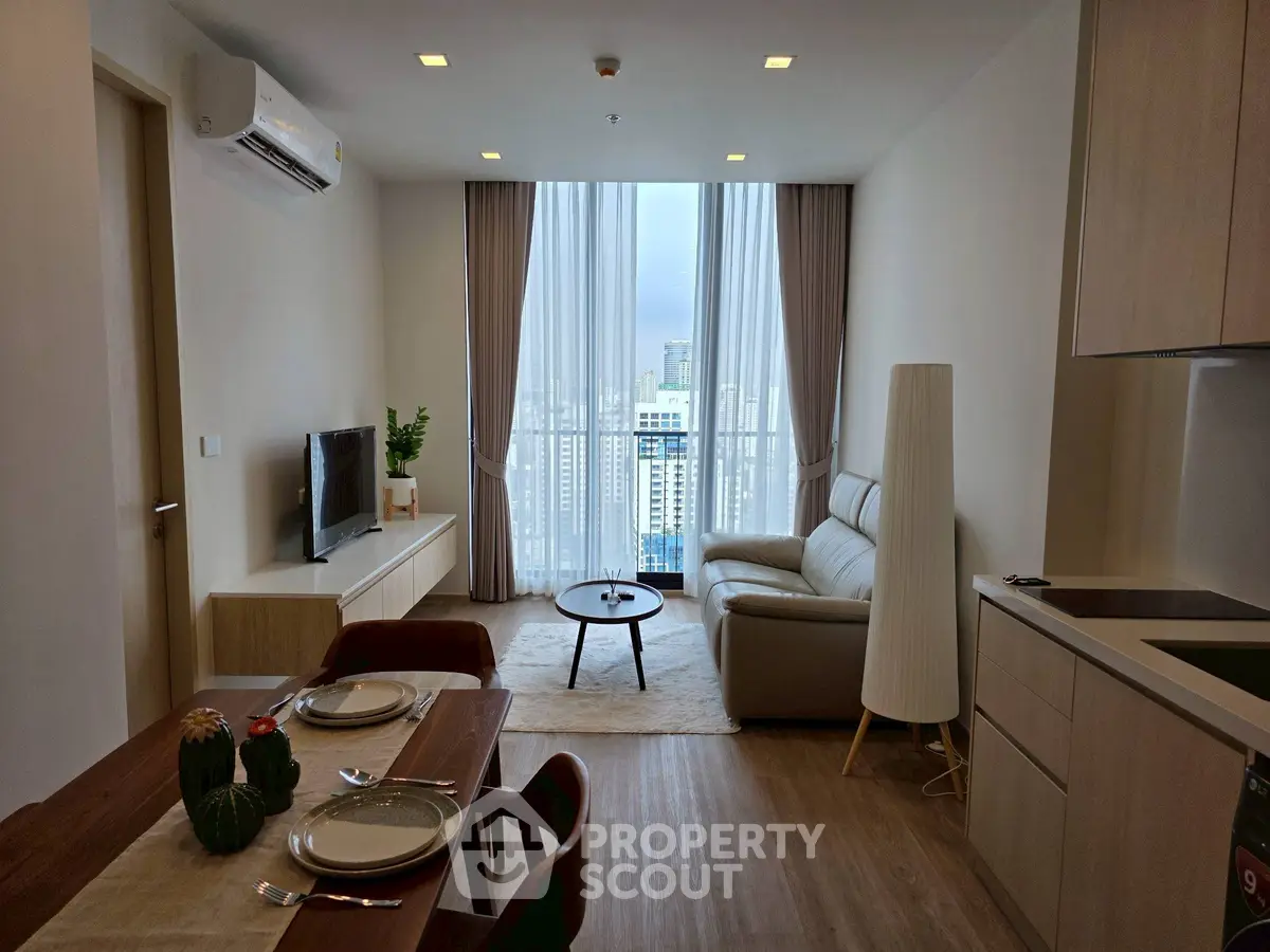 Modern living room with city view, stylish furniture, and cozy ambiance