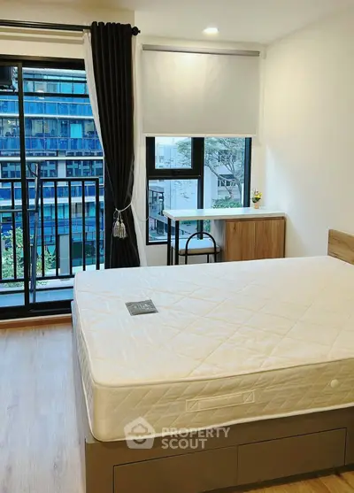 Modern bedroom with balcony view and stylish furniture