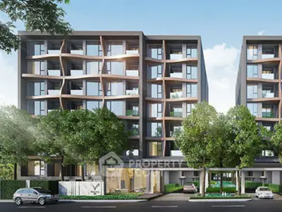 Modern apartment building with unique facade and lush greenery in urban setting.