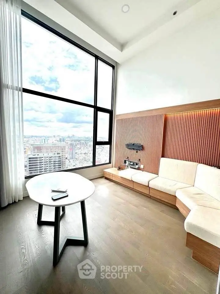 Luxurious high-rise living room with panoramic city view and modern decor