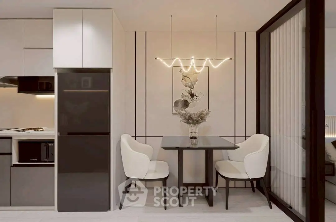 Modern kitchen with sleek design and elegant dining area, featuring stylish lighting and contemporary decor.