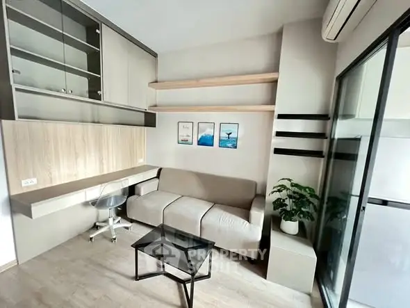 Modern living room with sleek furniture and built-in storage solutions.