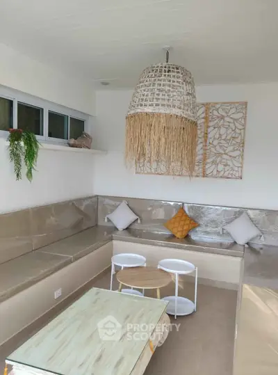 Stylish modern living room with cozy seating and chic decor, perfect for relaxation and entertaining.