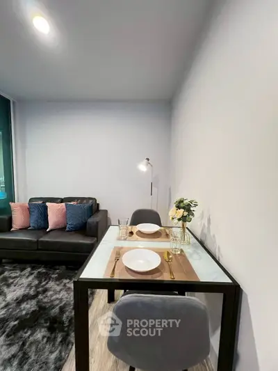 Modern living room with cozy dining area and stylish decor