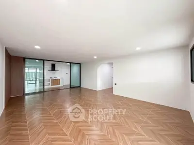Spacious modern living room with open layout and stylish flooring