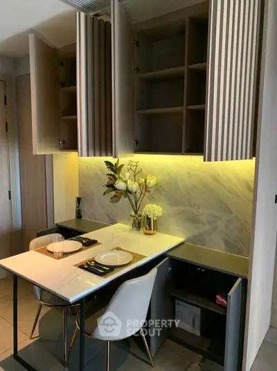 Modern kitchen with open cabinets and elegant dining setup