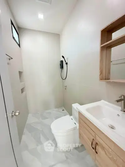 Modern minimalist bathroom with sleek fixtures and neutral tones