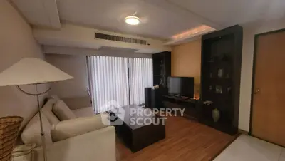 Cozy living room with modern furniture and natural light, perfect for relaxation and entertainment.