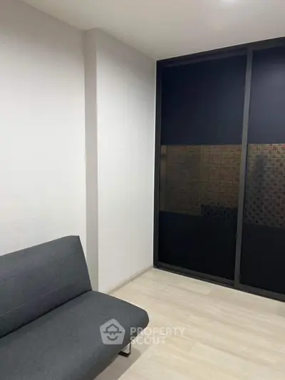 Minimalist room with sleek sofa and modern sliding door