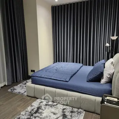 Luxurious modern bedroom with elegant decor and plush bedding