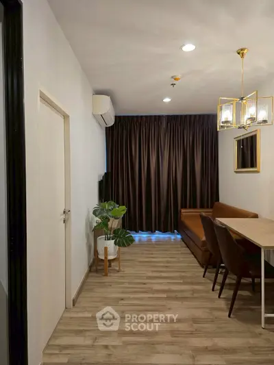 Stylish modern living room with elegant lighting and cozy seating area