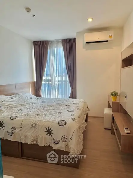 Cozy bedroom with natural light and modern furnishings