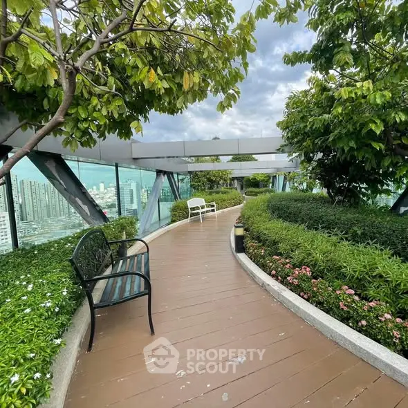Stunning rooftop garden with lush greenery and city views, perfect for relaxation and leisure.