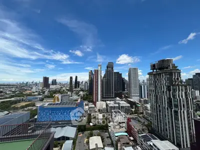 Stunning cityscape view from a high-rise building showcasing modern architecture and vibrant skyline.