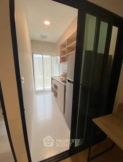 Modern kitchen with sliding glass door and ample natural light