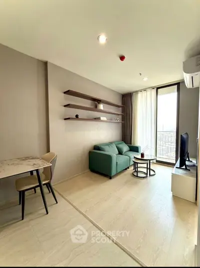 Modern living room with green sofa, wall shelves, and balcony view