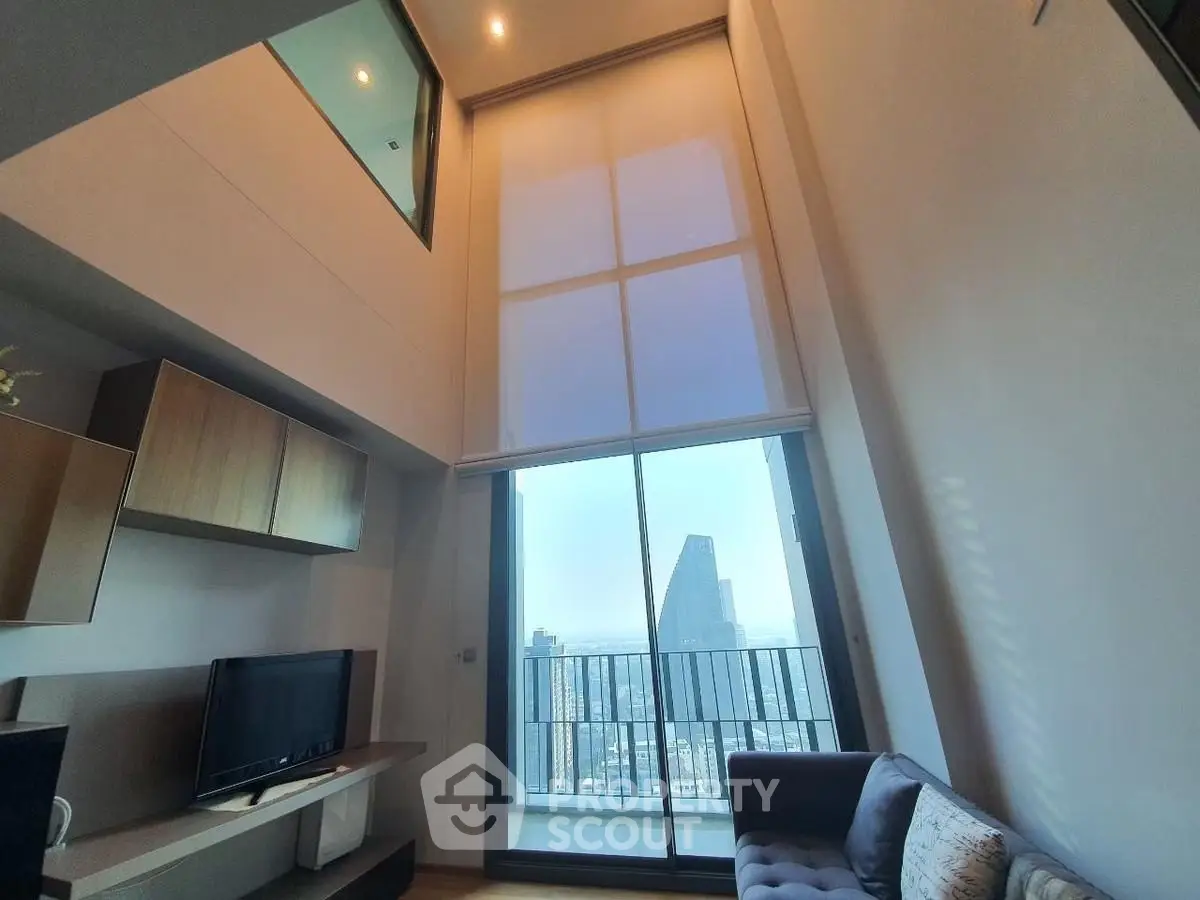 Stunning high-rise living room with floor-to-ceiling windows and city view
