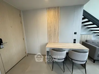 Modern interior with stylish furniture and staircase in a contemporary apartment.