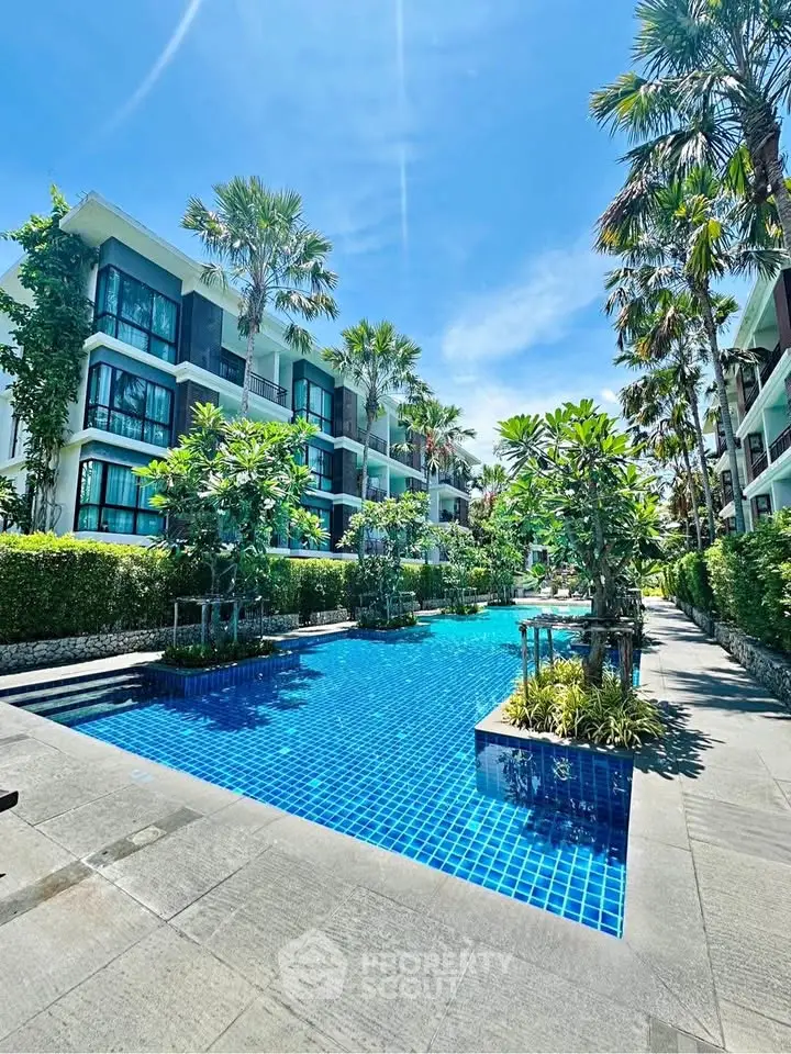 Luxurious condominium with stunning pool and lush greenery