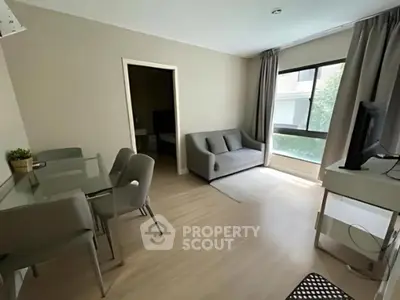 Modern living room with sleek furniture and natural light in a stylish apartment
