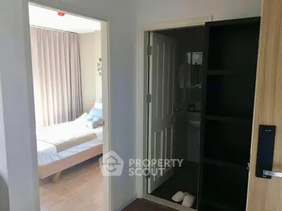 Cozy bedroom with ensuite bathroom in modern apartment