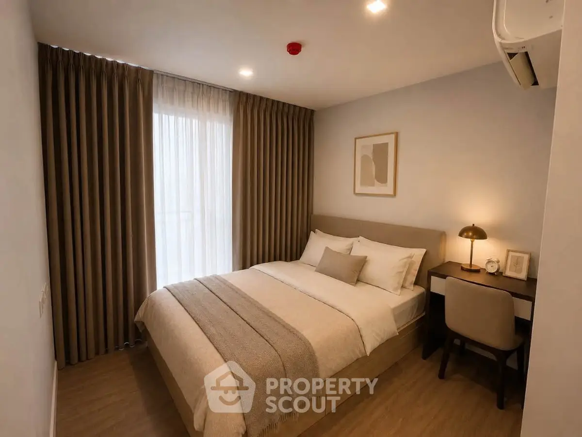 Cozy bedroom with modern decor and natural light, featuring a comfortable bed and stylish furnishings.