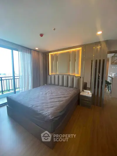 Luxurious modern bedroom with elegant lighting and balcony view